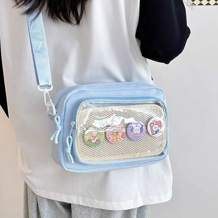 Shoulder bag with transparent viewing pocket and playful graphic design Bowlift