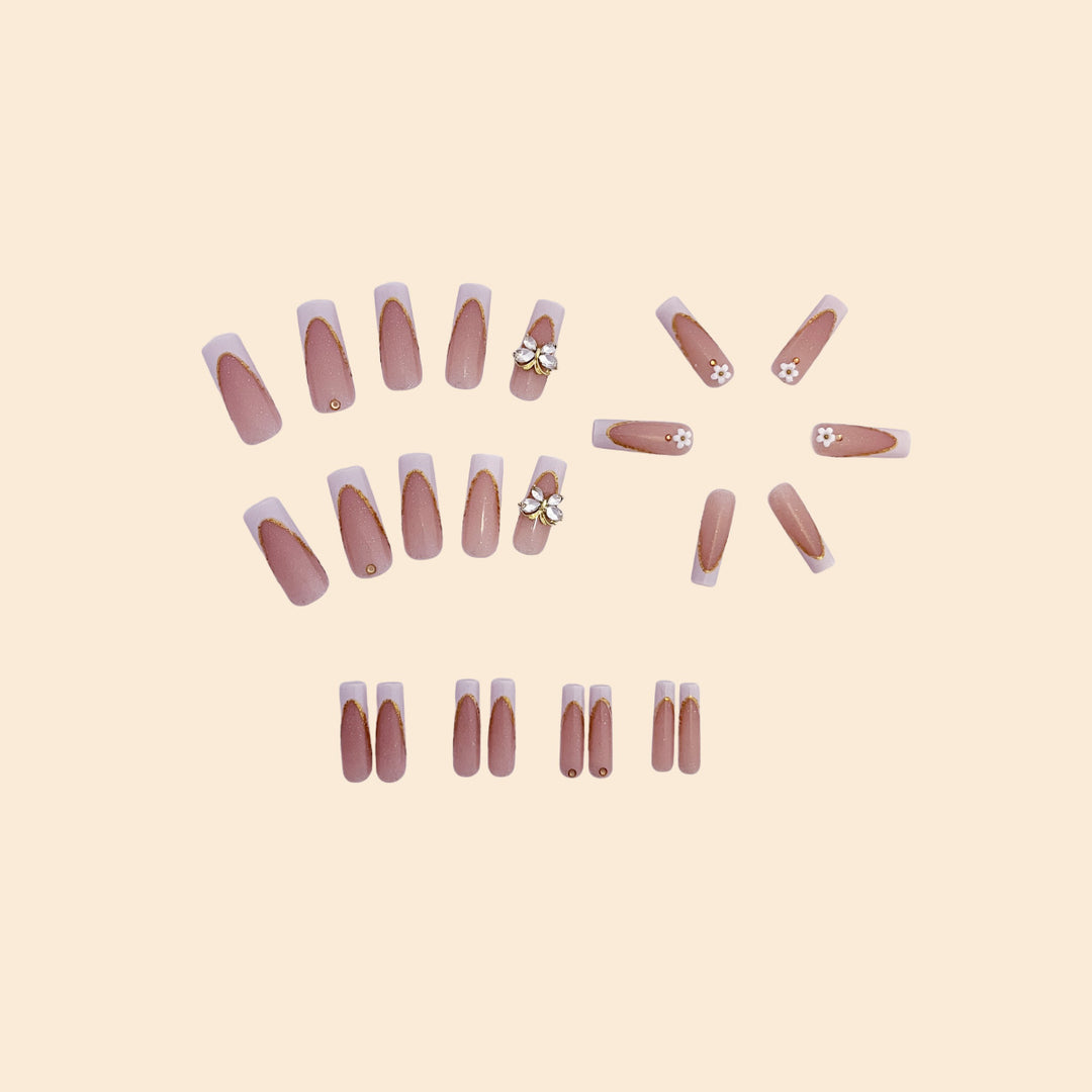 Elegant Gold Accented Stiletto Nail Extensions Bowlift