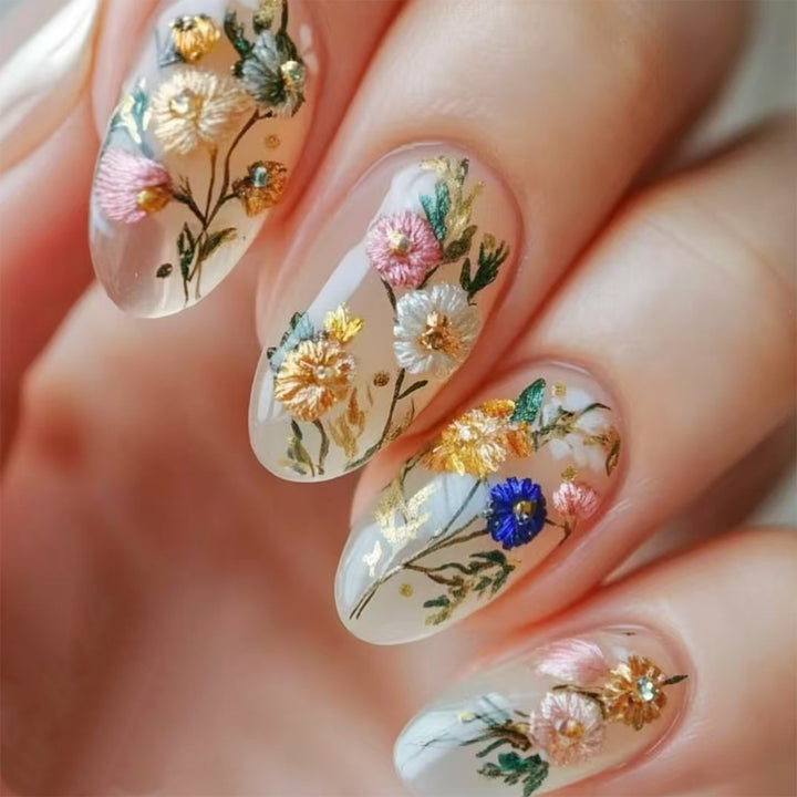 Artificial nails with floral designs and gold accents Bowlift