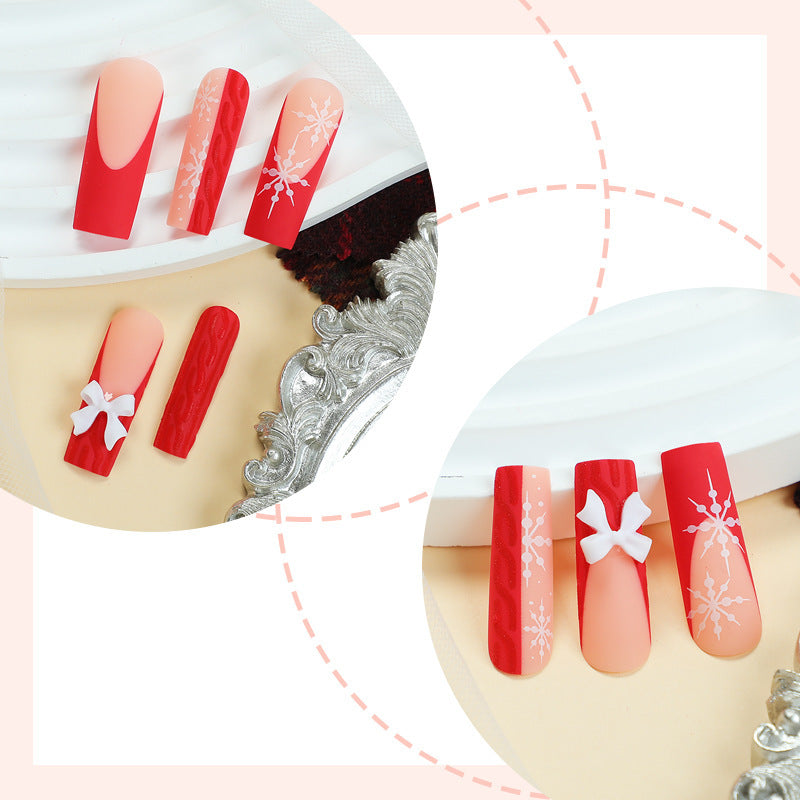 Artificial nail set with festive snowflake and bow motifs Bowlift