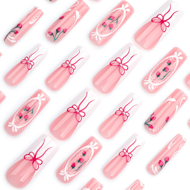 Artful nails with strawberry motifs and bow accents Bowlift
