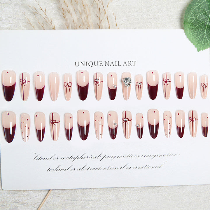 Artificial nail set with elegant bow and glitter details Bowlift