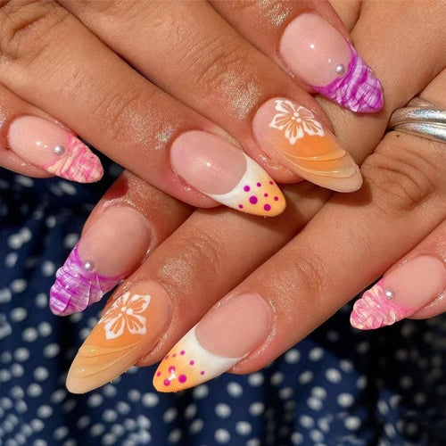 Acrylic nail set with exotic flower patterns and glitter accents Bowlift