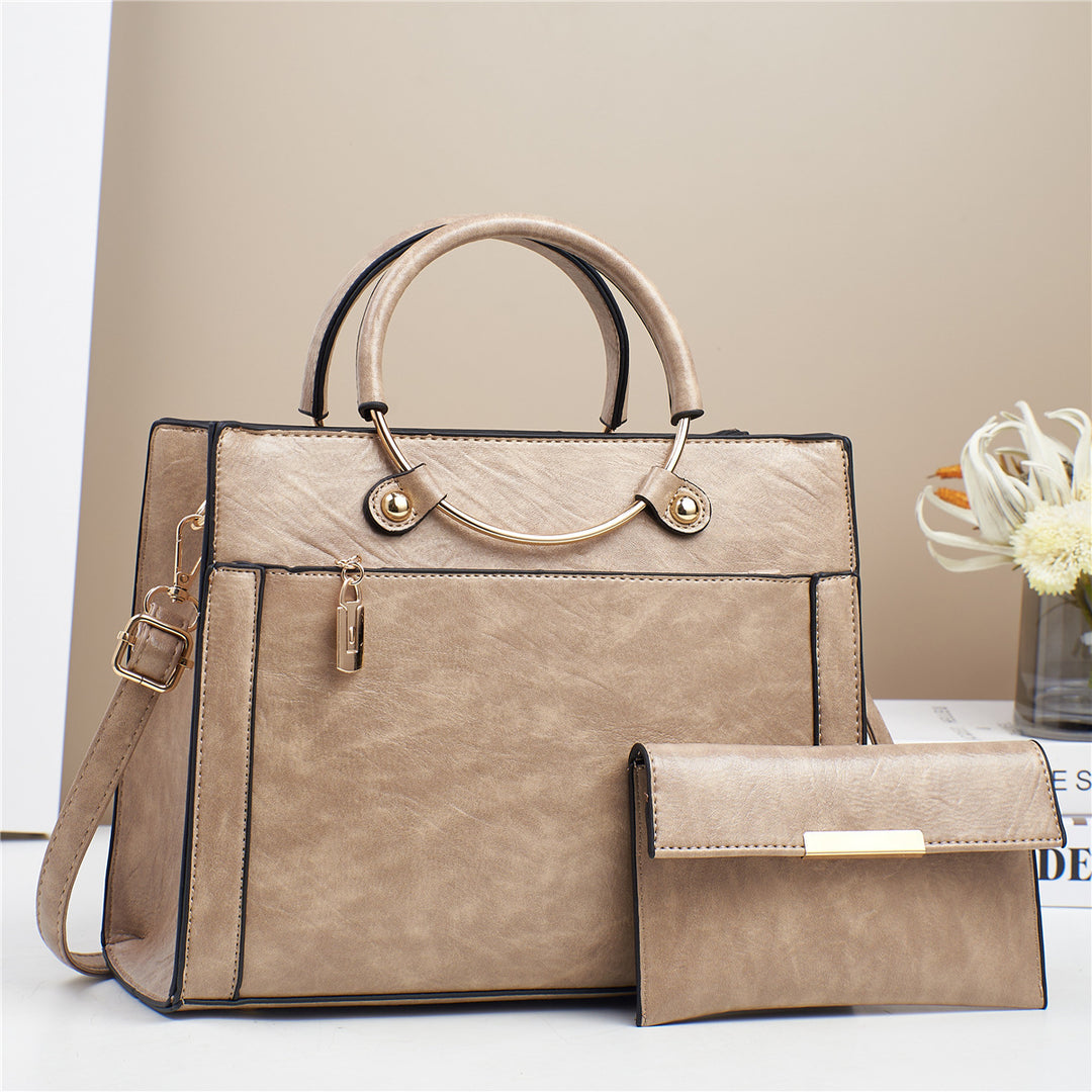 Elegant handbag with detachable shoulder strap and matching wallet Bowlift