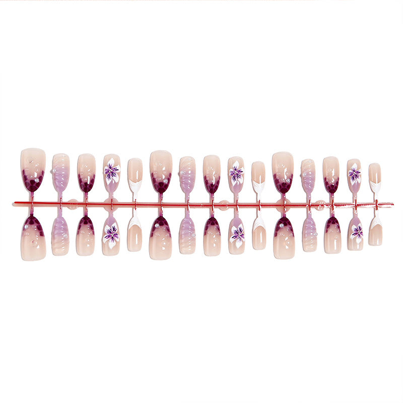 Artificial nail set with elegant ombre design and floral accents Bowlift