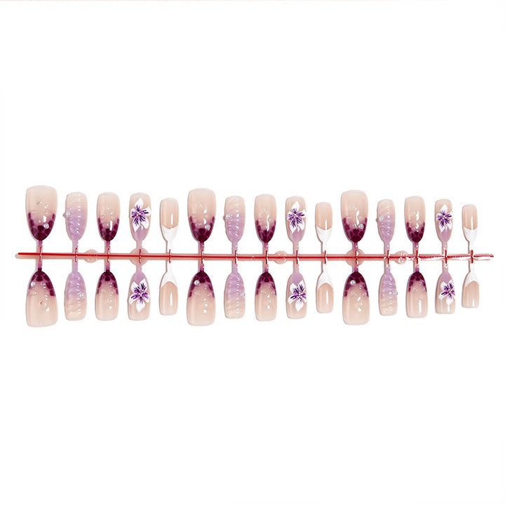 Artificial nail set with elegant ombre design and floral accents Bowlift