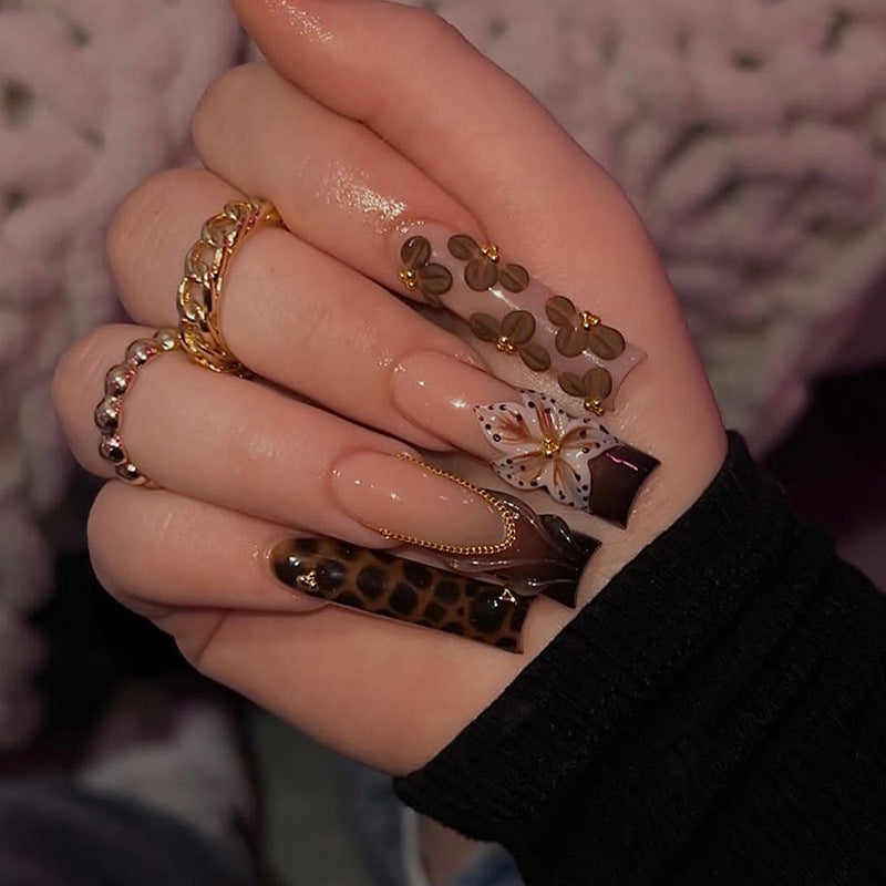 Nail design with floral accents and elegant details Bowlift