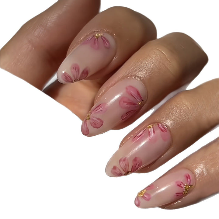 Artificial nail set with floral accents and gold embellishments Bowlift