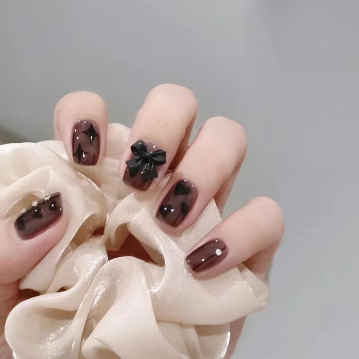 Artificial nails with elegant ribbon and heart designs Bowlift