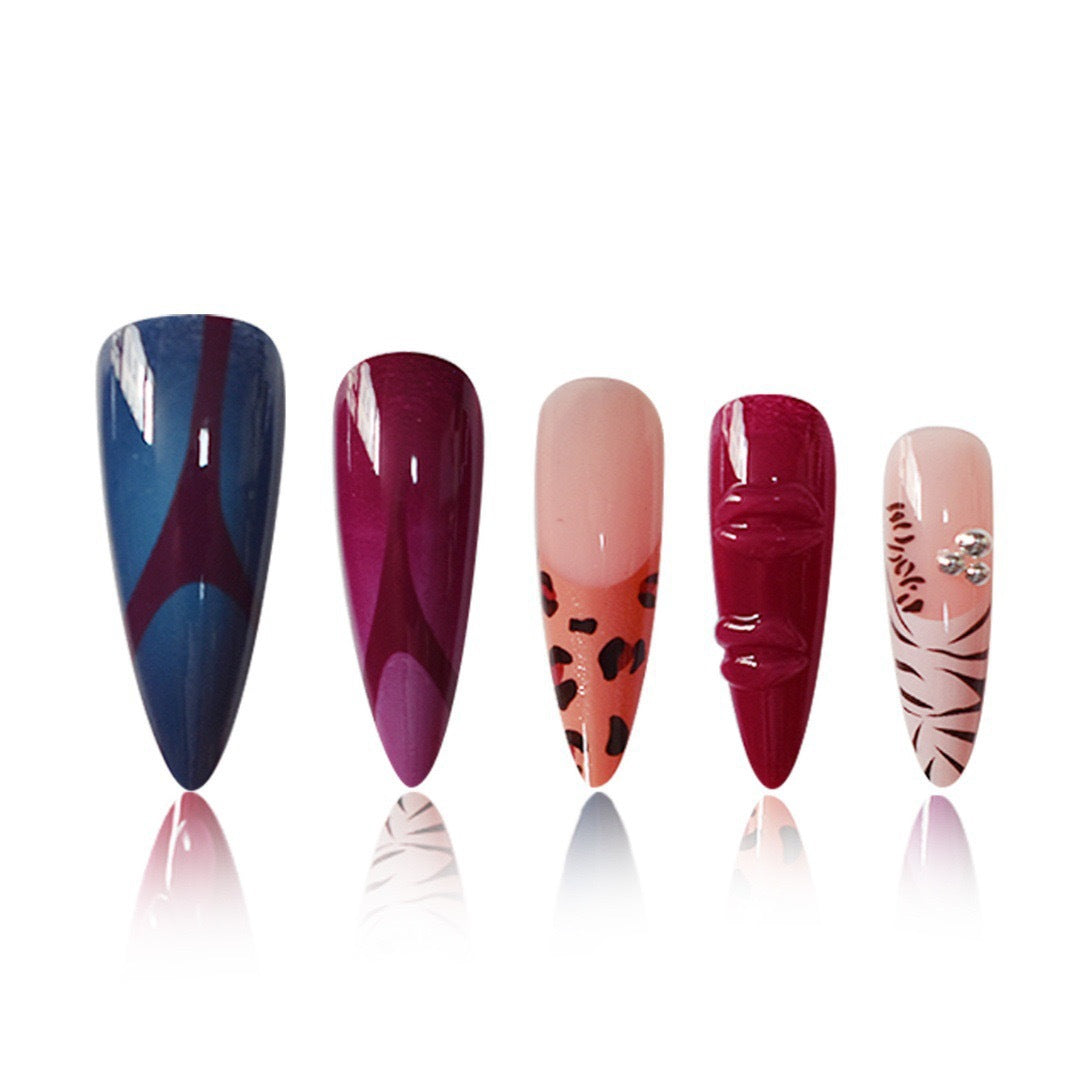 Artistic Stiletto Nail Enhancements with Trendy Animal Print and Gem Accents Bowlift