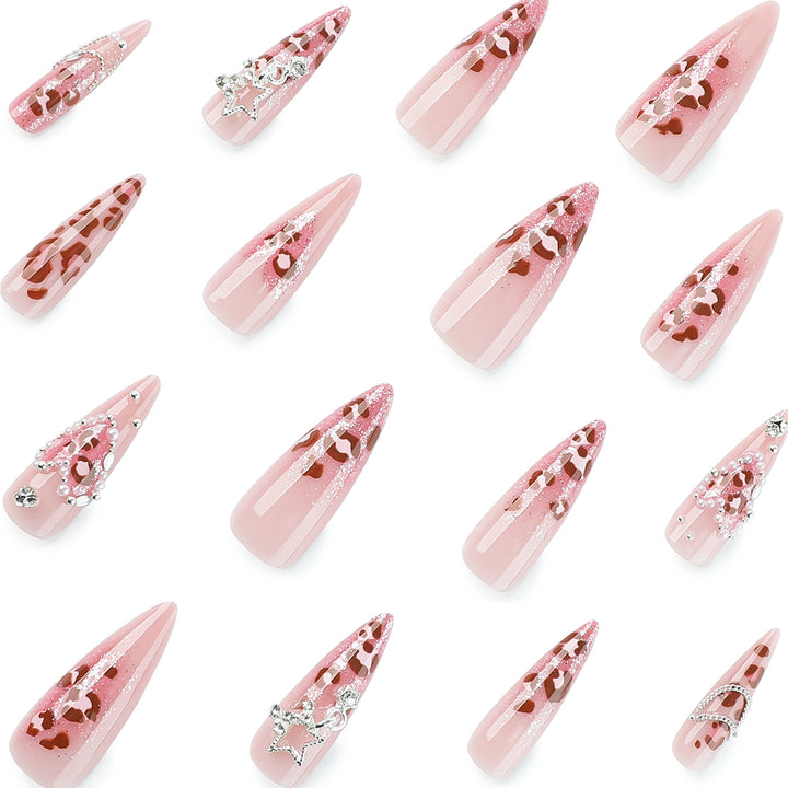 Artistic stiletto nails with glitter and jewelry accents Bowlift