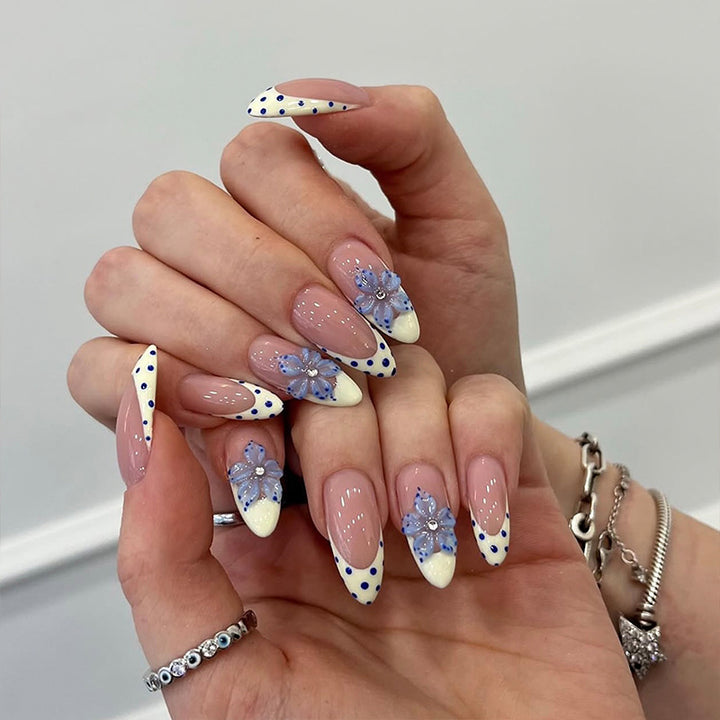 Artificial nail set with glamorous floral designs and creative glitter accents Bowlift