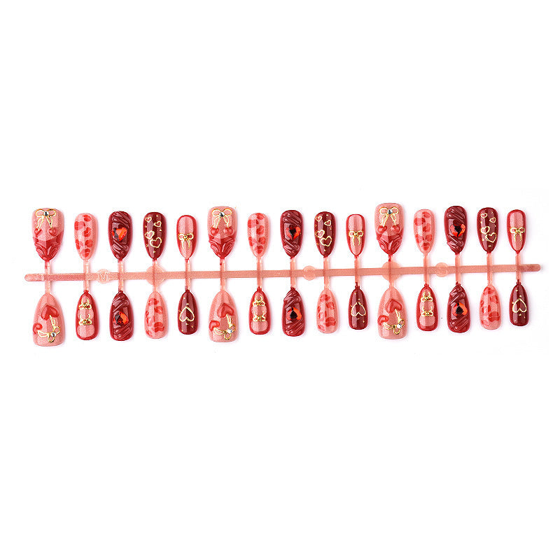 Festive artificial nails with romantic heart designs Bowlift