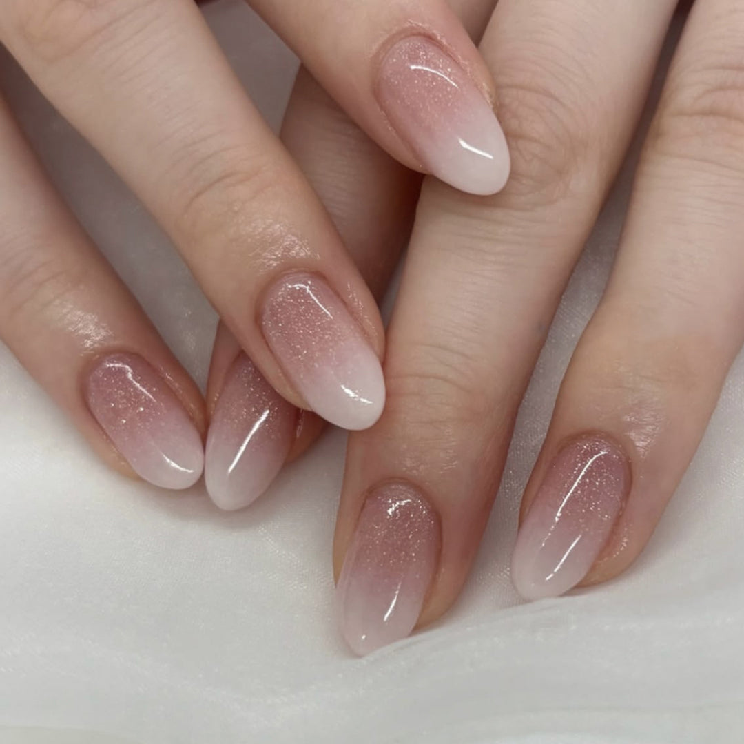 Luxurious nail extensions with elegant glitter ombre coating Bowlift
