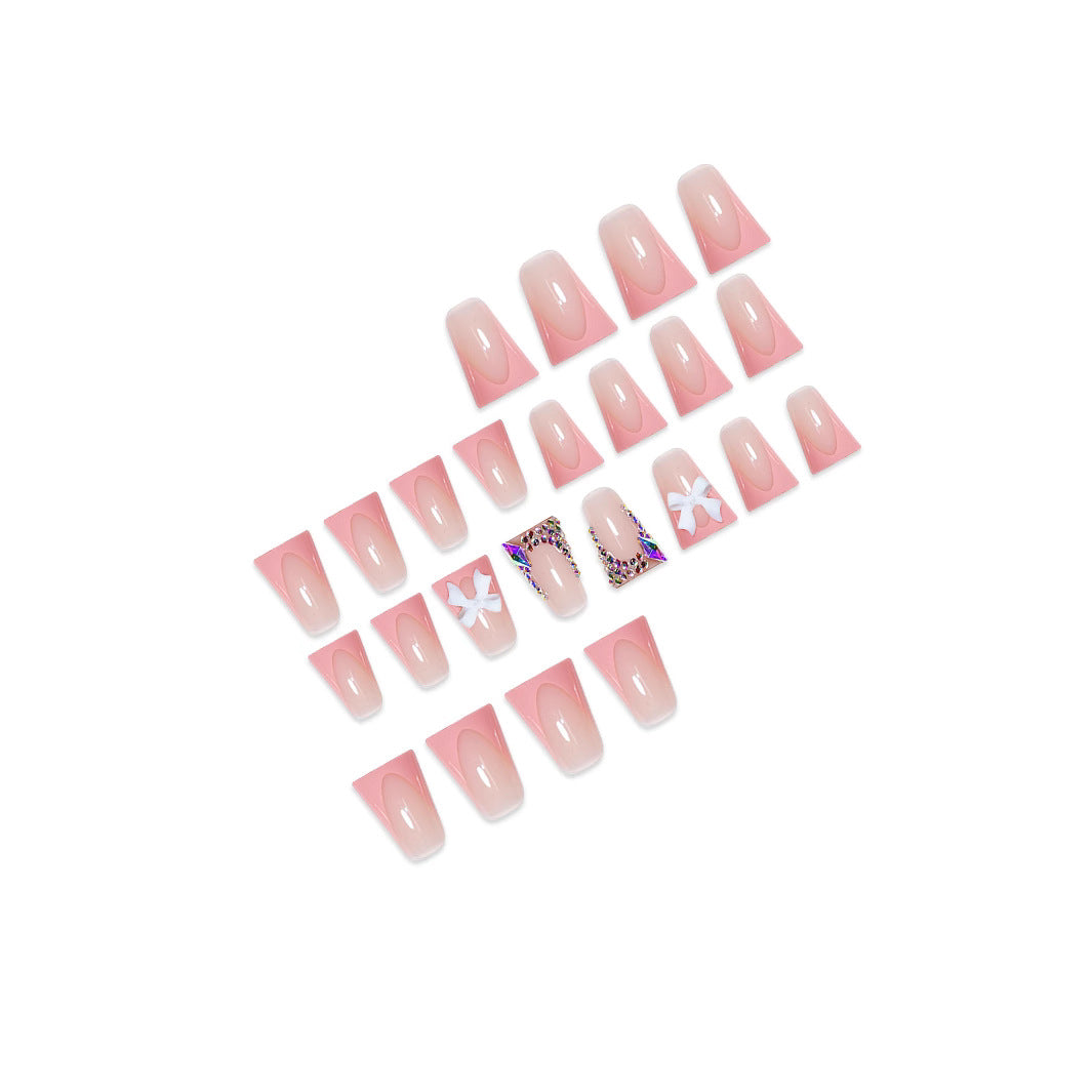 Decorative Acrylic Nail Enhancements with Bow and Rhinestone Accents Bowlift