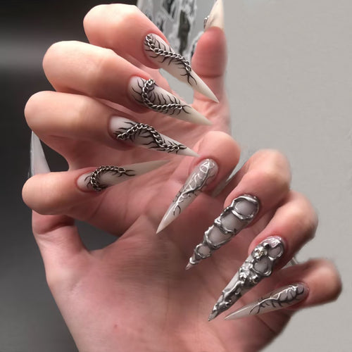 Creative nail art set with elegant floral designs and metallic accents Bowlift