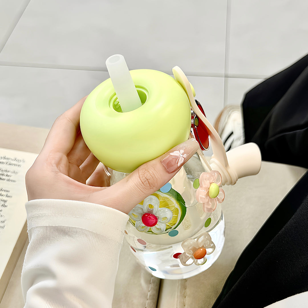 Women's water bottle with integrated fruit filter and practical carrying handle Bowlift