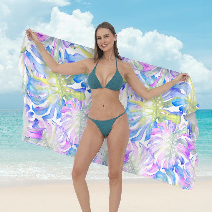 Beach towel with vibrant tropical plant motif Bowlift