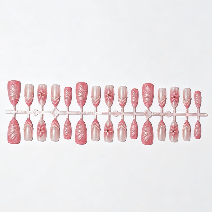 Artificial nail set with filigree flowers and glitter accents Bowlift