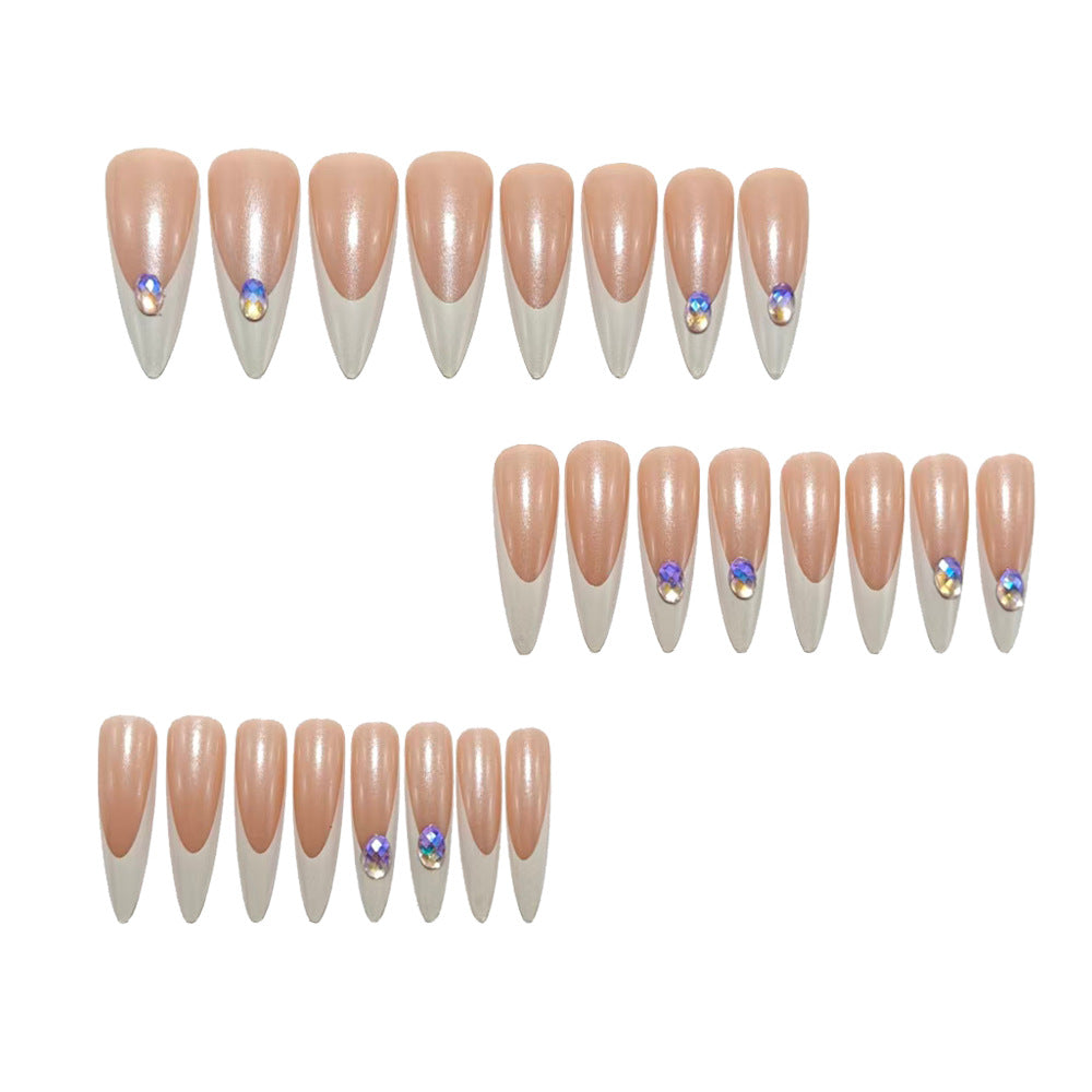 Artificial nails in modern stiletto design with glitter accents Bowlift