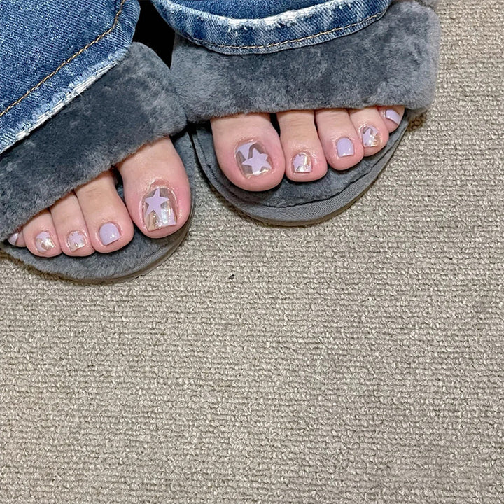 Artistic toenail art with rhinestone and glitter elements Bowlift