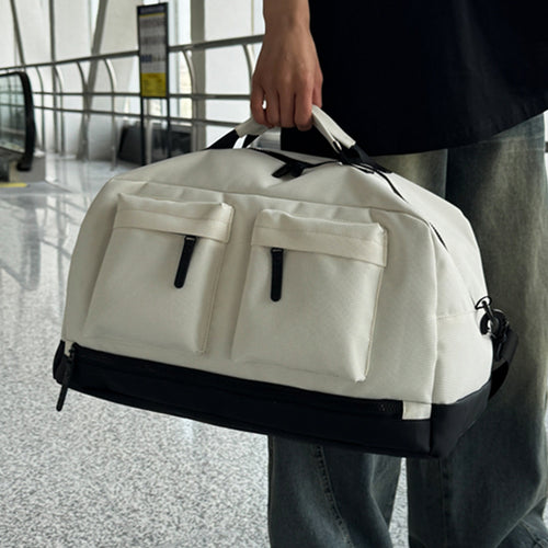 Sporty travel bag with two additional outer pockets Bowlift
