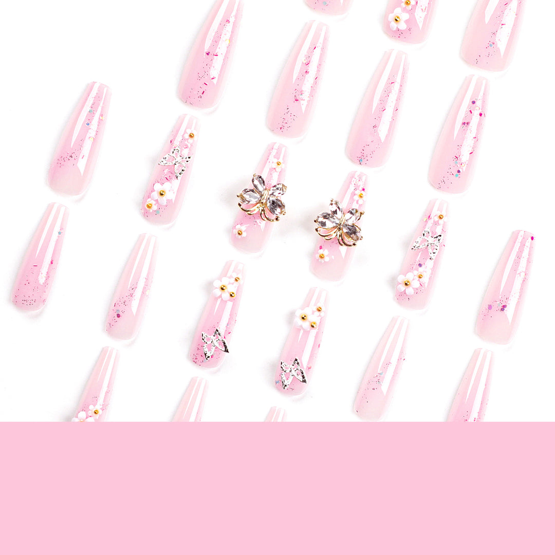 Artistic Nail Extensions with Glitter and Floral Accents Bowlift