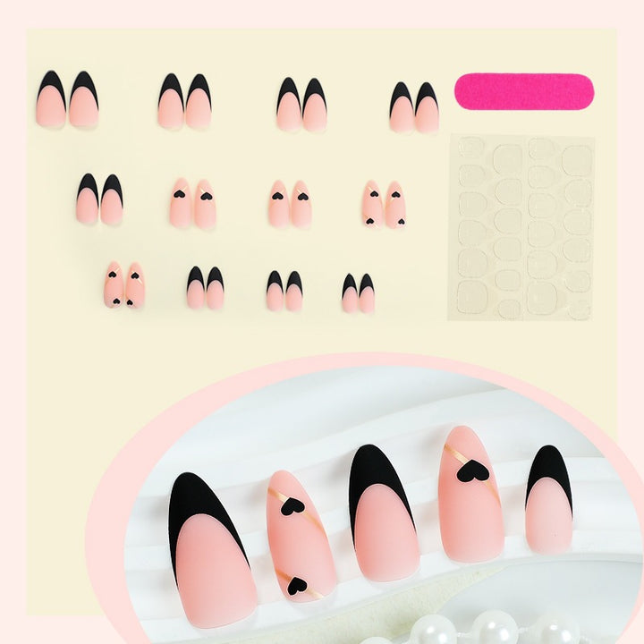Creative nail art set with heart-shaped accents and elegant French tips Bowlift