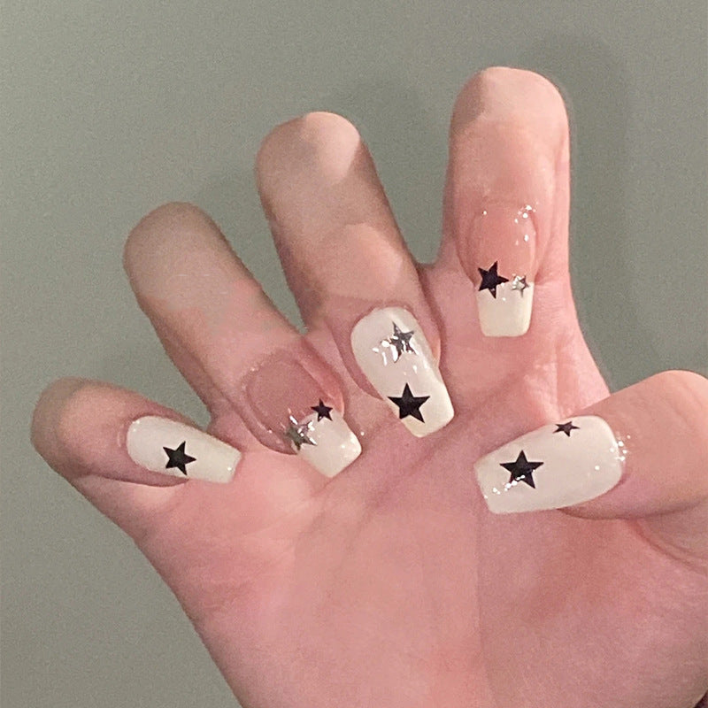 Artificial nail set with glamorous star design and sparkling accents Bowlift