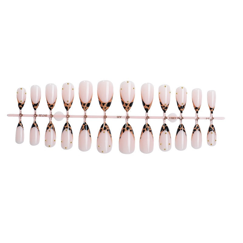 Acrylic nail set with elegant leopard design and gold accents Bowlift