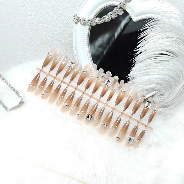 Artificial nails with sparkling rhinestone decorations Bowlift