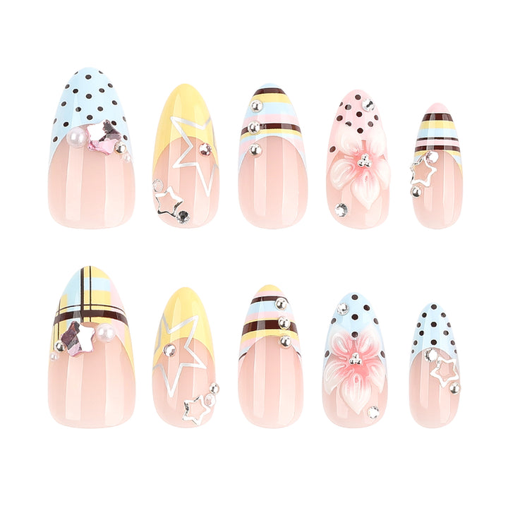 Creative nail designs with floral accents and glitter Bowlift