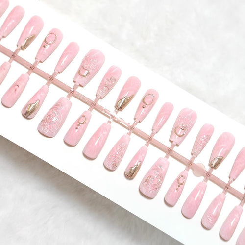 Artificial nails with elegant gold embellishments Bowlift
