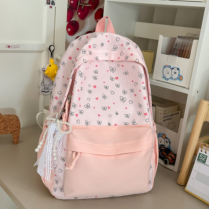 Playful Heart and Bow Patterned Backpack