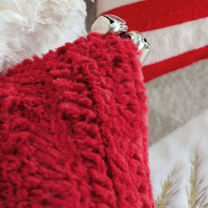 Rectangular plush decorative pillow with textured knit look and metal eyelets Bowlift