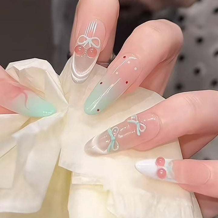 Artificial nail set with elegant bow and cherry designs Bowlift