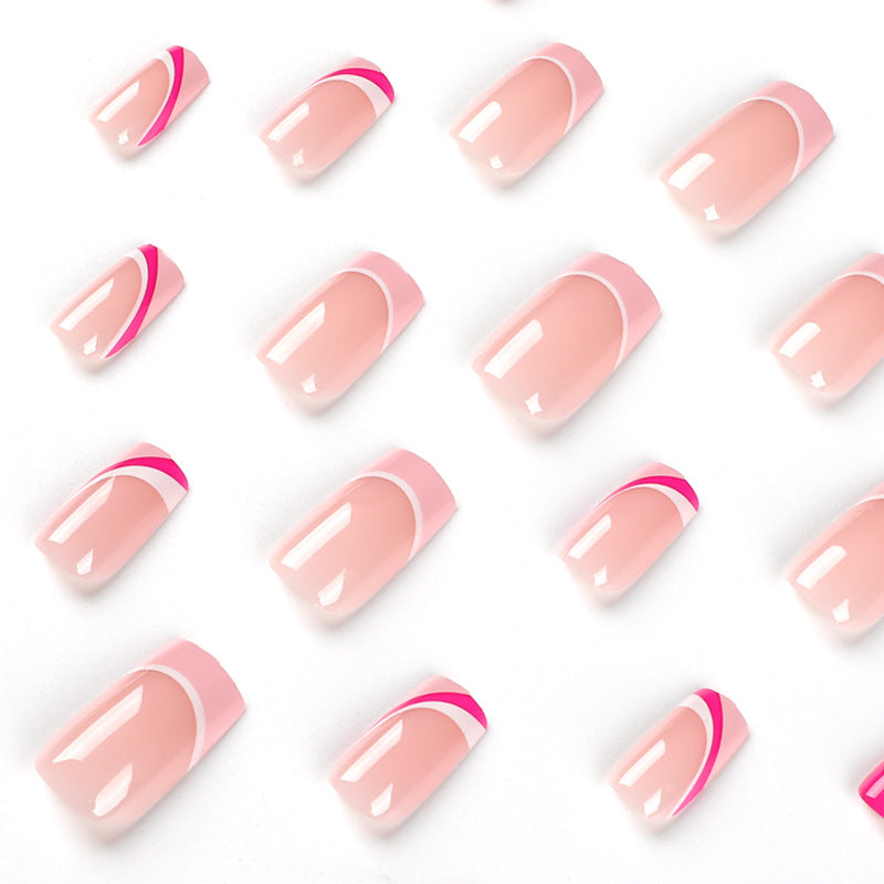 Acrylic nail extensions with elegant gradient and curved accents Bowlift