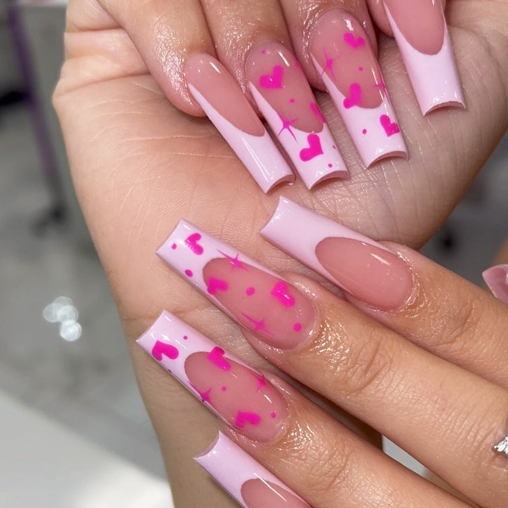 Artful Nail Extensions with Heart-Shaped Accents Bowlift