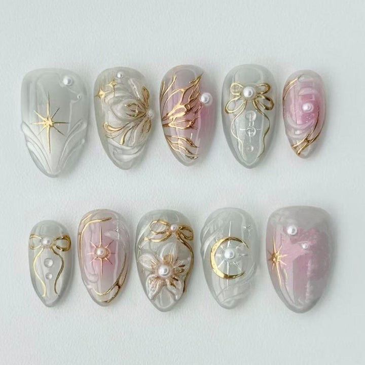 Artificial nail set with filigree golden accents Bowlift