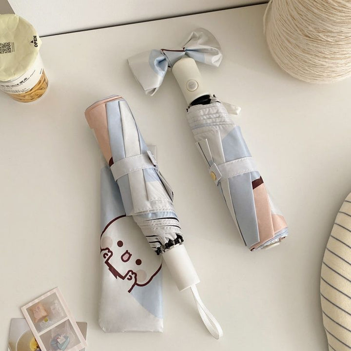Ladies folding umbrella with playful animal motif Bowlift