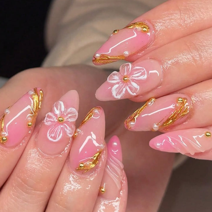 Creative nail art set with floral and golden accents Bowlift
