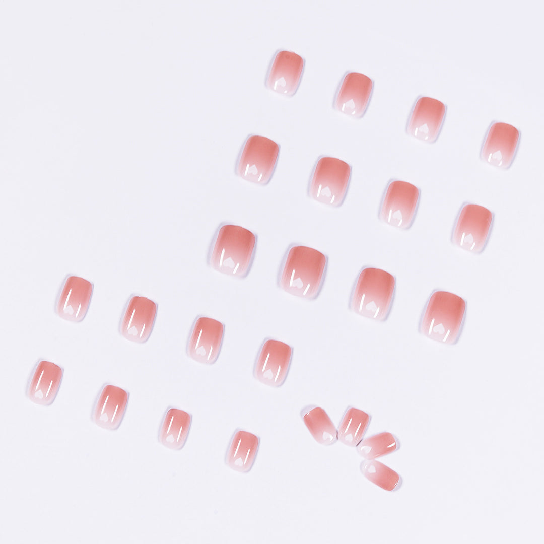 Artful nail art with heart-shaped accents and gentle ombre effect Bowlift