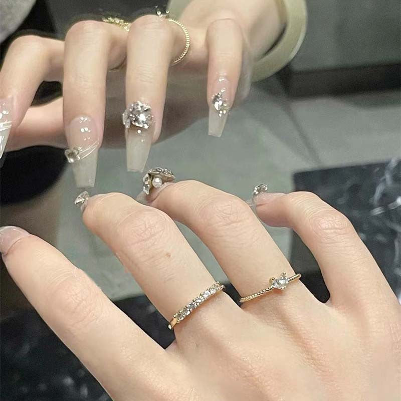 Art nail set with filigree decorations and glamorous accents Bowlift