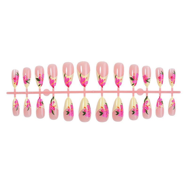 Artificial nail set with floral accents and glamorous finish Bowlift