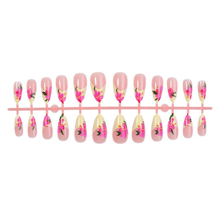 Artificial nail set with floral accents and glamorous finish Bowlift