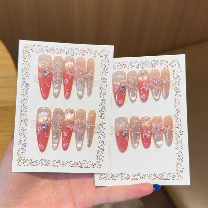 Artificial nails with floral embellishments and glitter effects Bowlift