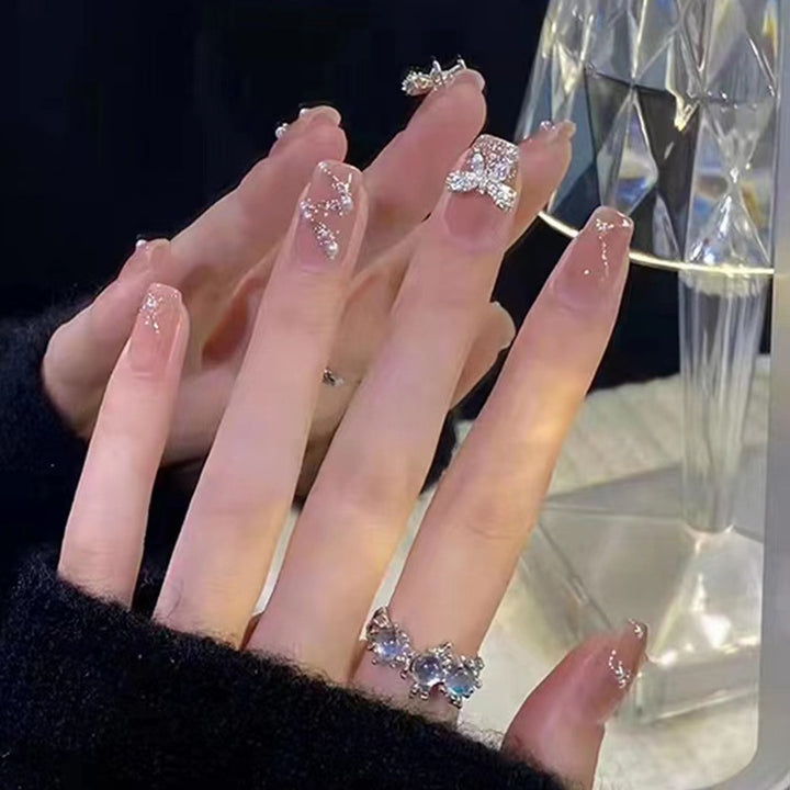 Artificial nails in an elegant design with 3D butterflies and glitter accents Bowlift