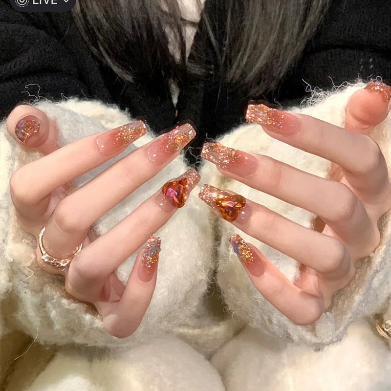 Artificial nail set with glitter and heart accents Bowlift