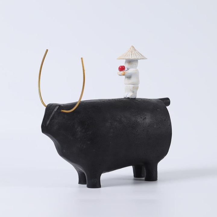 Decorative Angel Figurine on Black Bull Sculpture