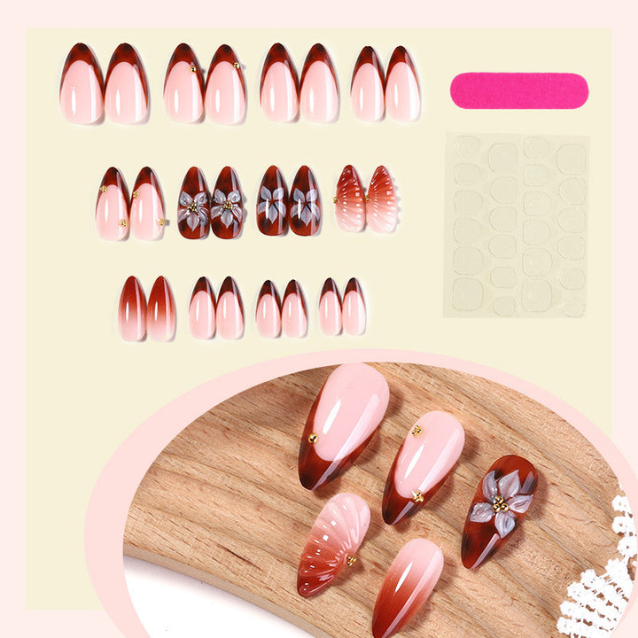 Nail art set with detailed ombre design and creative flower accents Bowlift